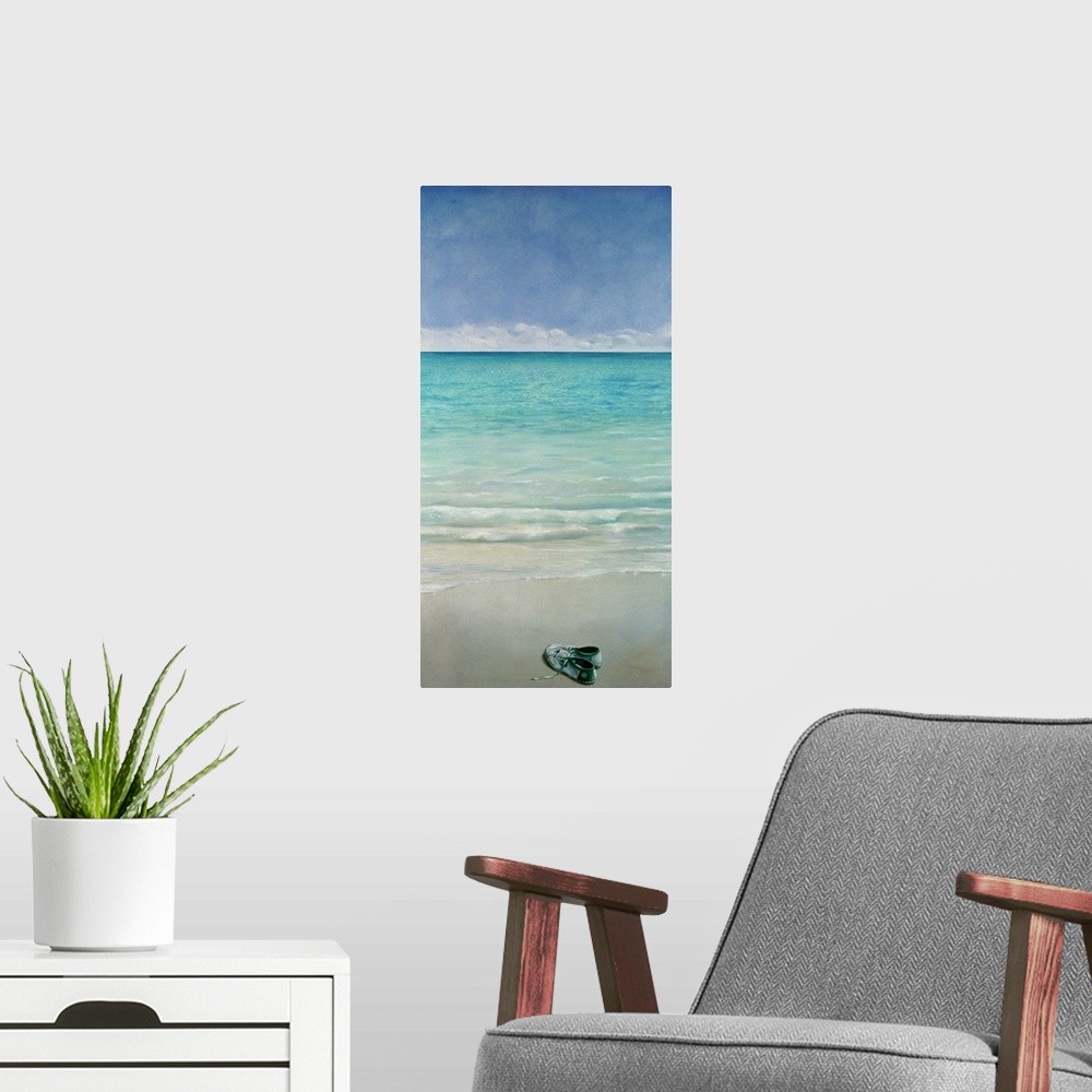 A modern room featuring Large vertical painting of a single pair of tennis shoes sitting on a sandy beach as clear blue w...