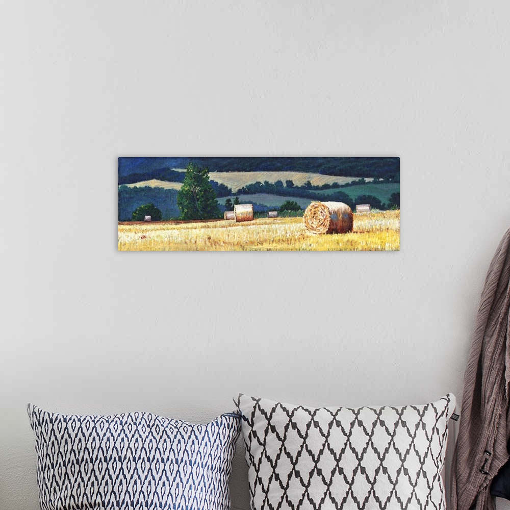A bohemian room featuring Contemporary painting of a countryside scene with hay bails in a farmed field.