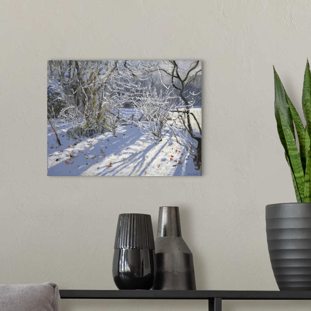 A modern room featuring Contemporary painting of a countryside scene covered in the snow of winter.