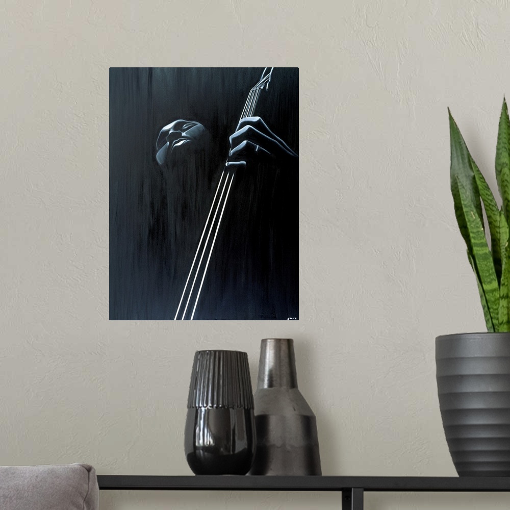A modern room featuring Big contemporary monochromatic art focuses on a close-up of a man playing the bass against a slig...
