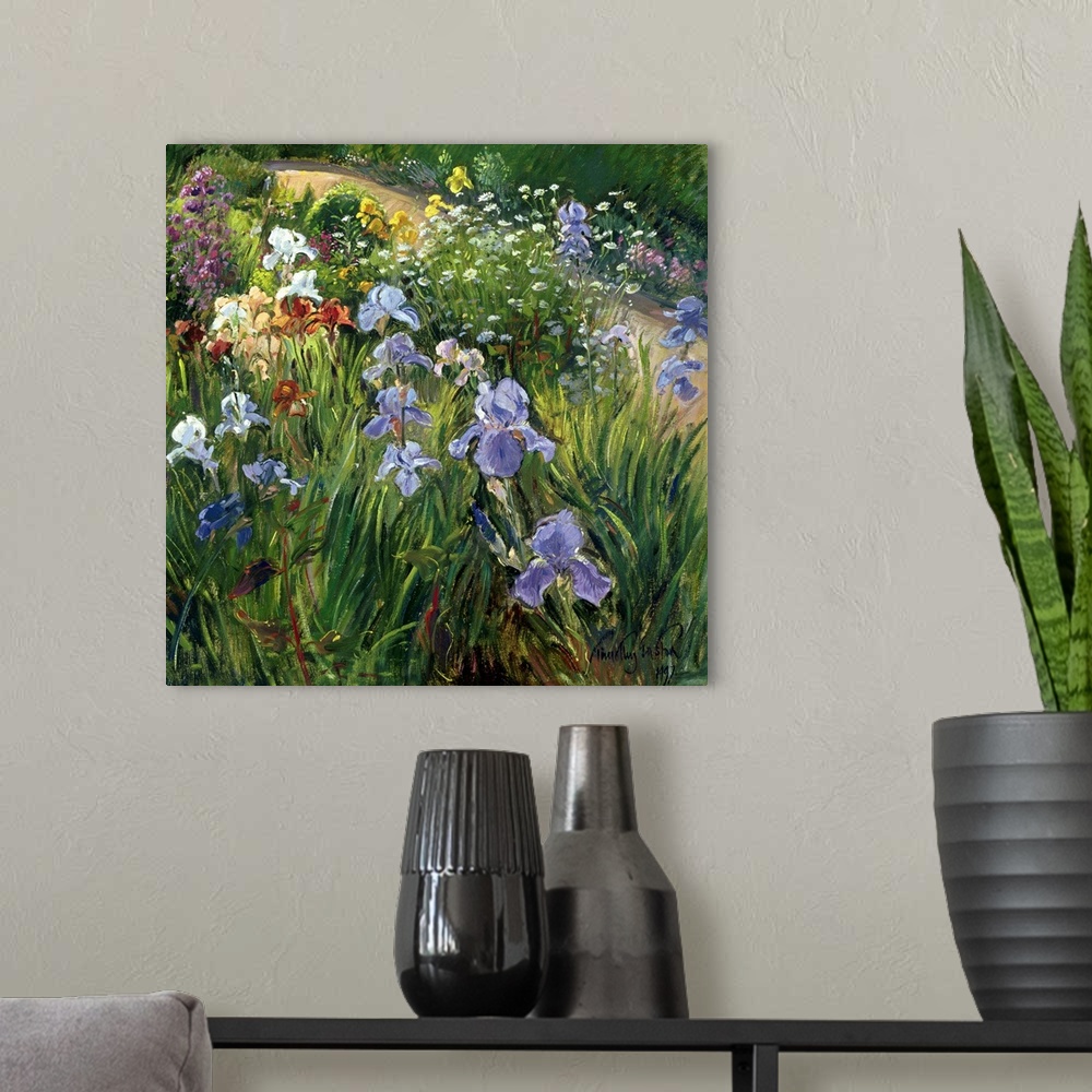 A modern room featuring Large square floral art focuses on a variety of flowers at close range that includes irises and o...