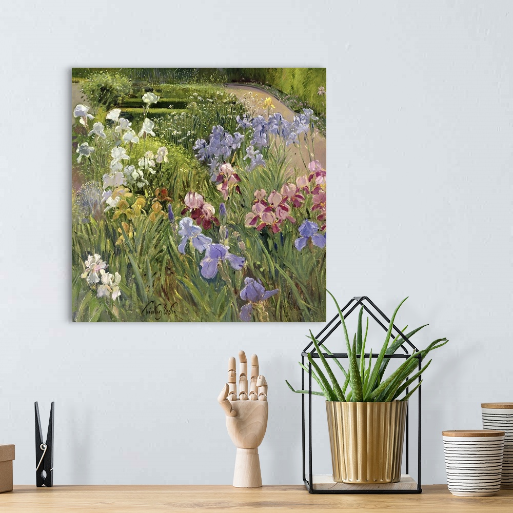 A bohemian room featuring A beautiful painting of different types of flowers in a lush green garden.