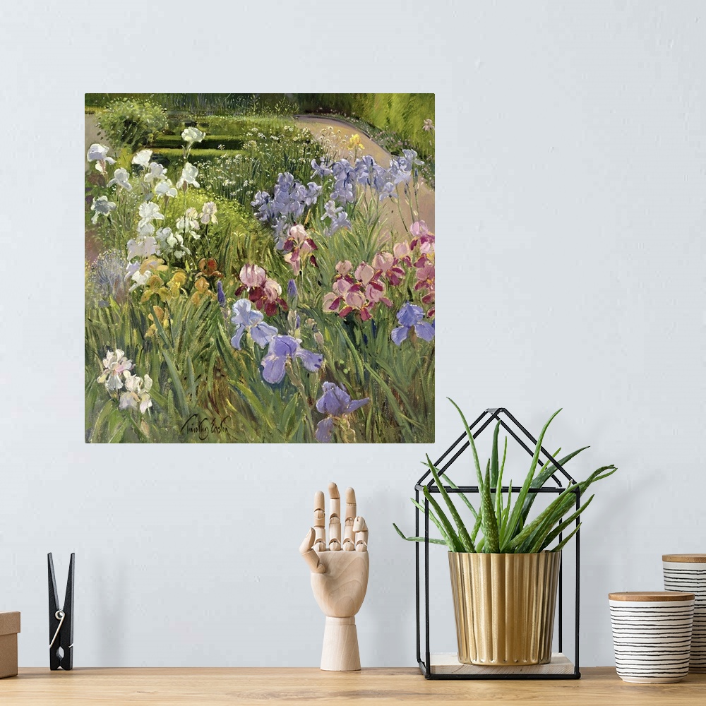A bohemian room featuring A beautiful painting of different types of flowers in a lush green garden.