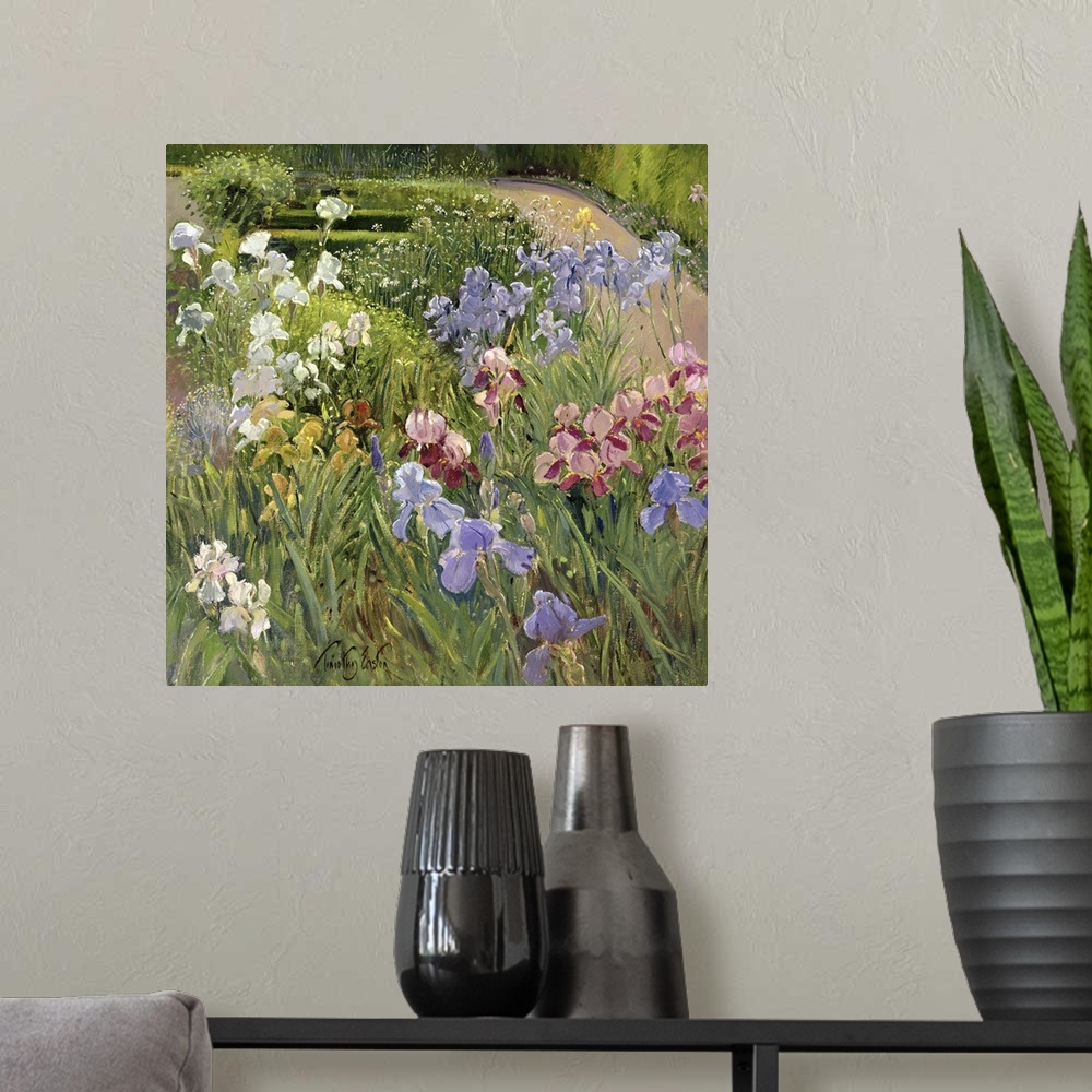 A modern room featuring A beautiful painting of different types of flowers in a lush green garden.