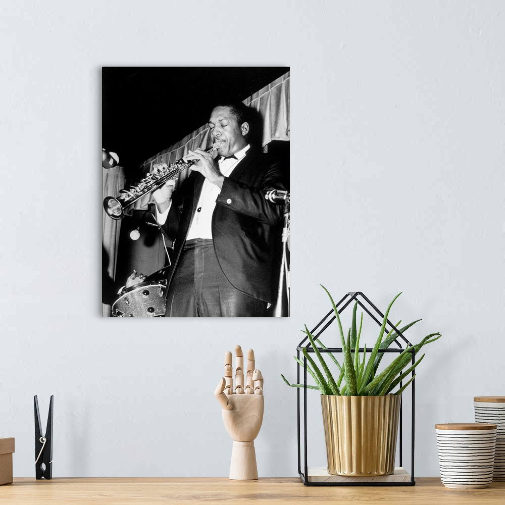 A bohemian room featuring American jazz saxophone player John Coltrane (1926-1967) here playing the soprano saxophone, 60\'...