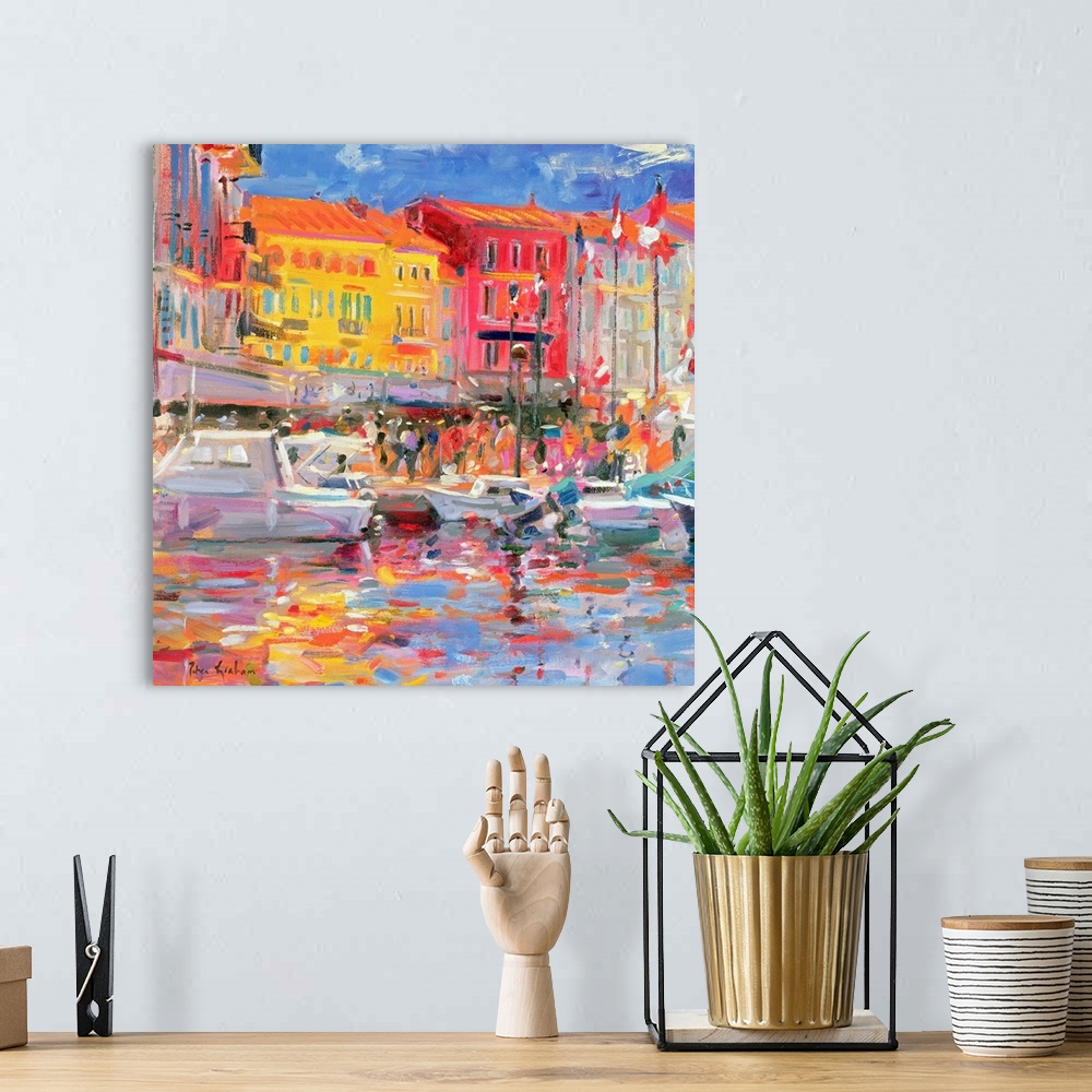 A bohemian room featuring Contemporary abstract painting of boats in a canal with buildings a long of it made up of large b...