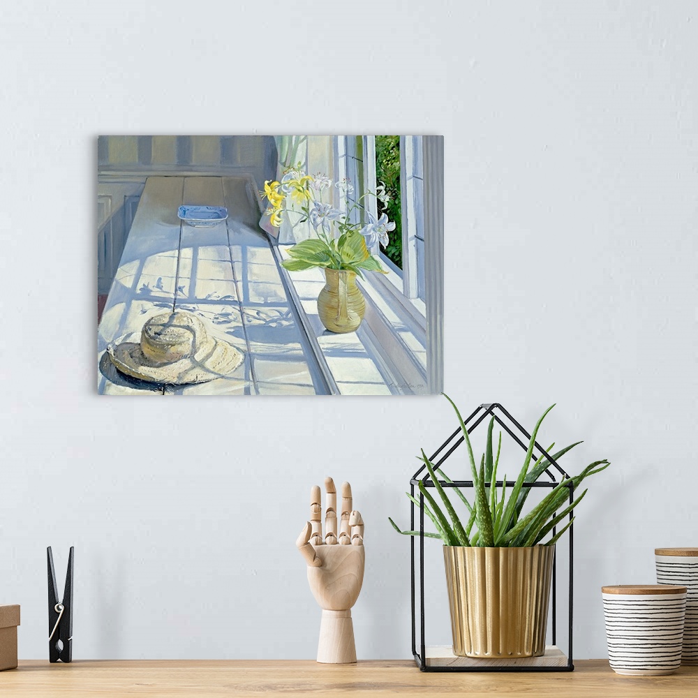 A bohemian room featuring Lilies and a Straw Hat