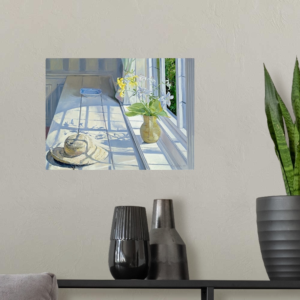 A modern room featuring Lilies and a Straw Hat