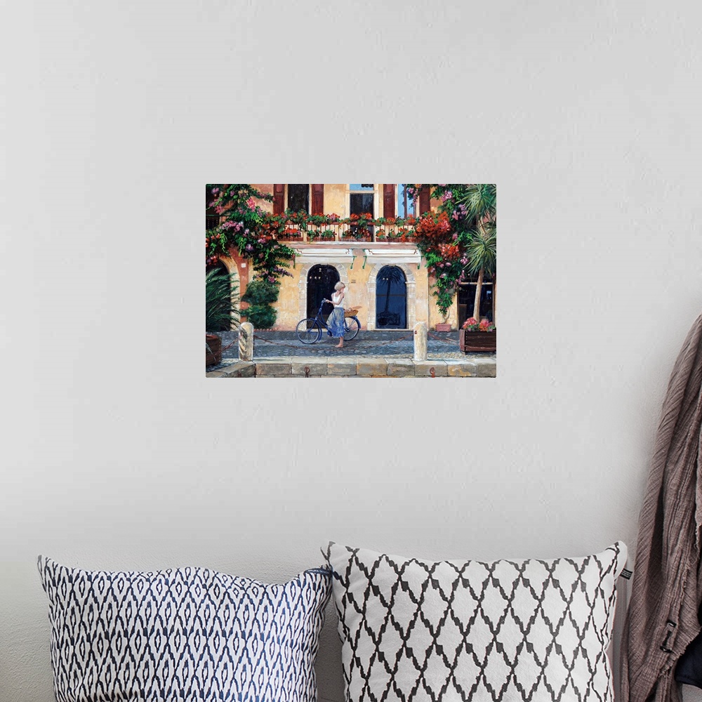 A bohemian room featuring Big oil painting on canvas of a woman riding a bike through an Italian street.