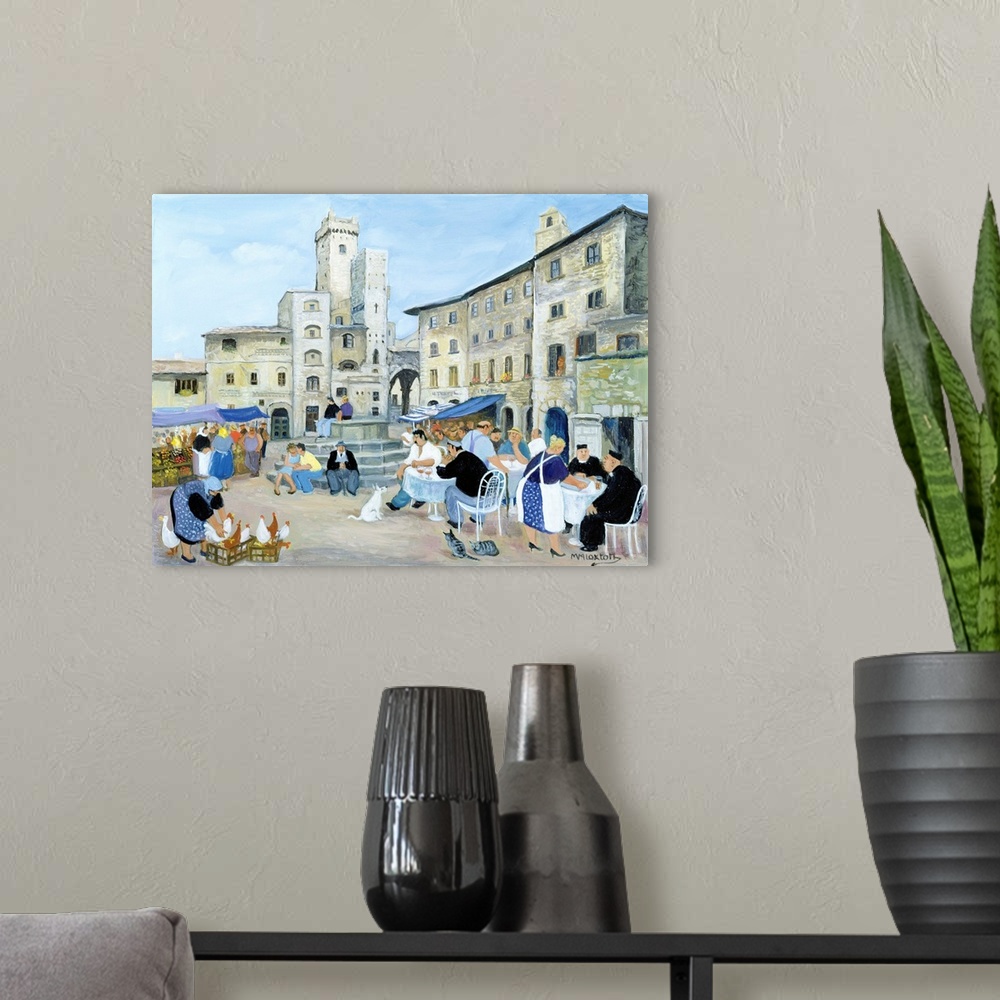 A modern room featuring Contemporary painting of people eating outdoors in a Tuscan town.