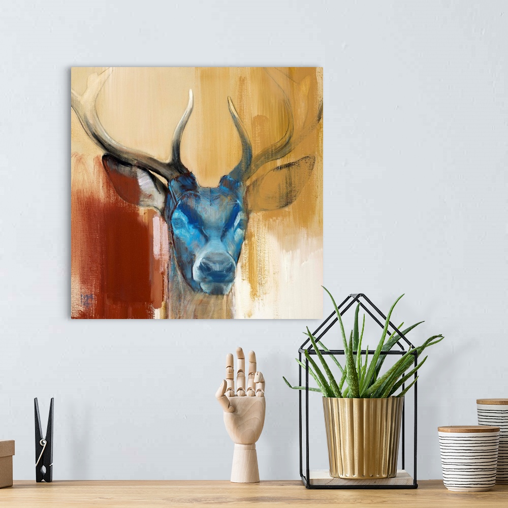 A bohemian room featuring Contemporary artwork of a stag with a blue face against an earthy background.