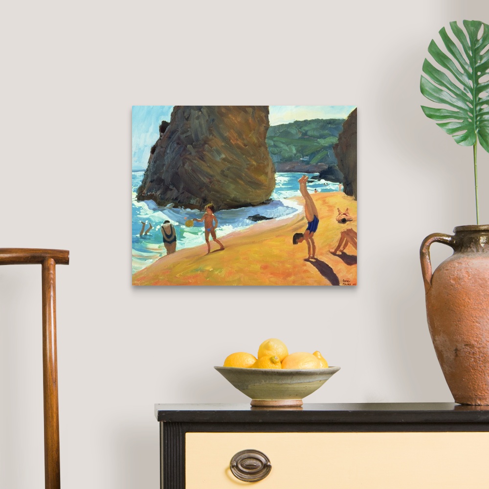 A traditional room featuring Horizontal painting on a big canvas of people playing on the beach, near the water, large boulder...