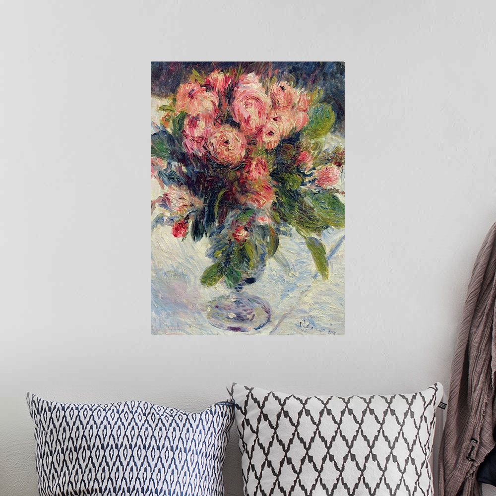 A bohemian room featuring Traditional painting of pastel colored flower bouquet in vase that is sitting on table.
