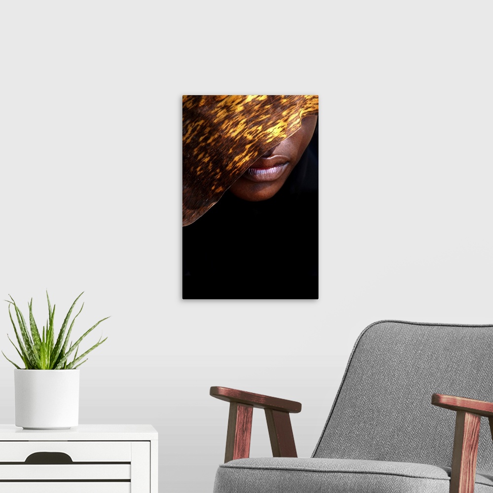 A modern room featuring A contemporary fine art photograph of the lower part of a woman's face, the rest of which is hidd...