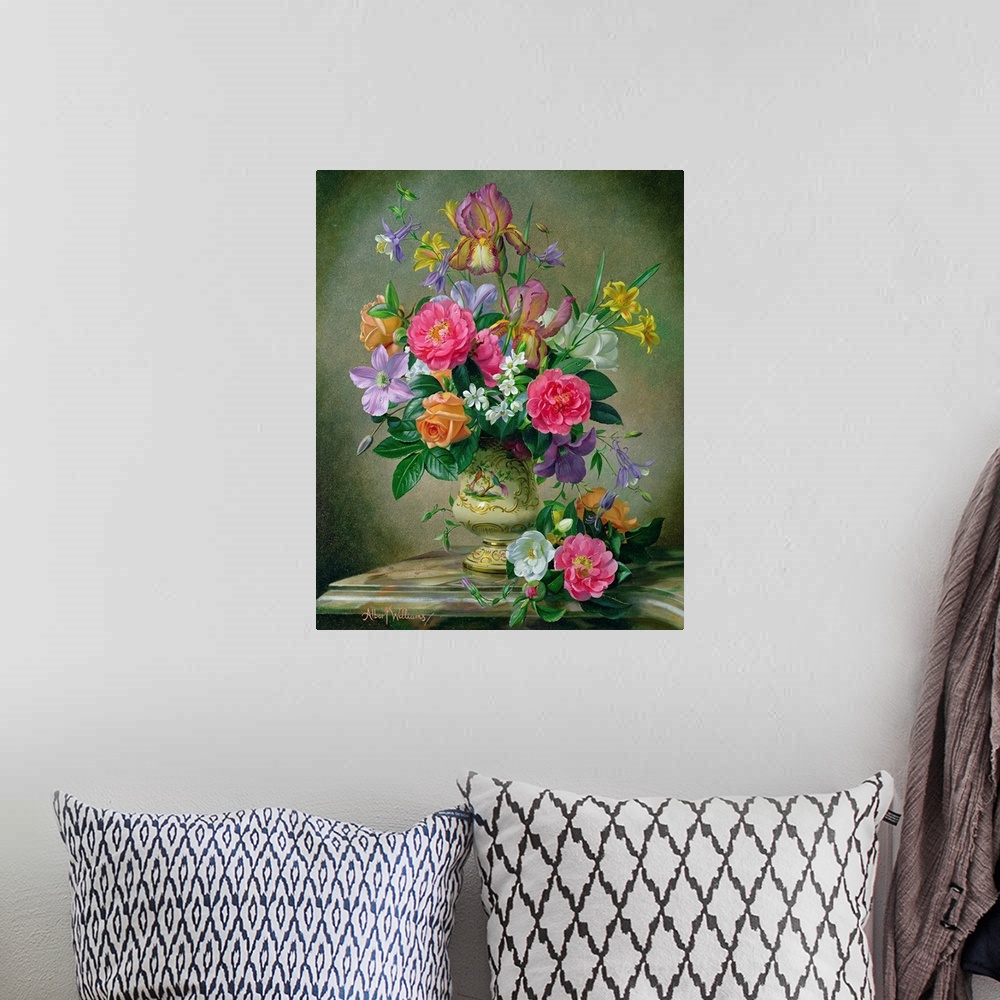 A bohemian room featuring A large vertical painting of colorful flowers inside an antique vase with a neutral background.