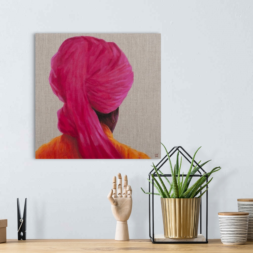 A bohemian room featuring Contemporary painting of a rear view of a man with a pink turban against a neutral background.