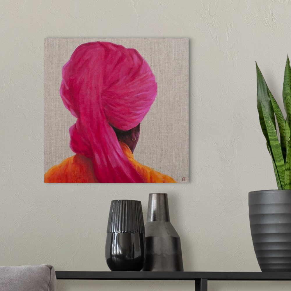 A modern room featuring Contemporary painting of a rear view of a man with a pink turban against a neutral background.