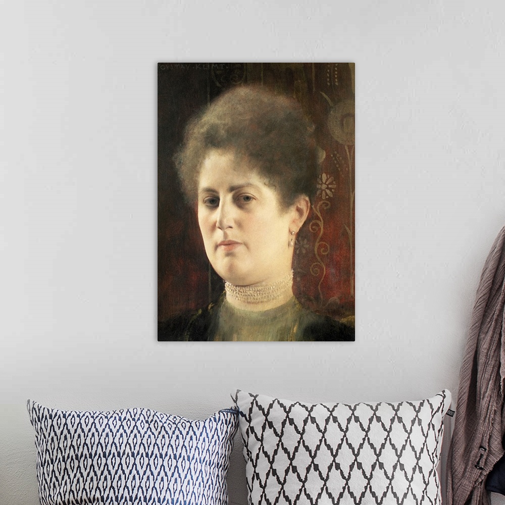 A bohemian room featuring Classic piece of artwork that is a portrait of a woman in front of a red background that has flor...