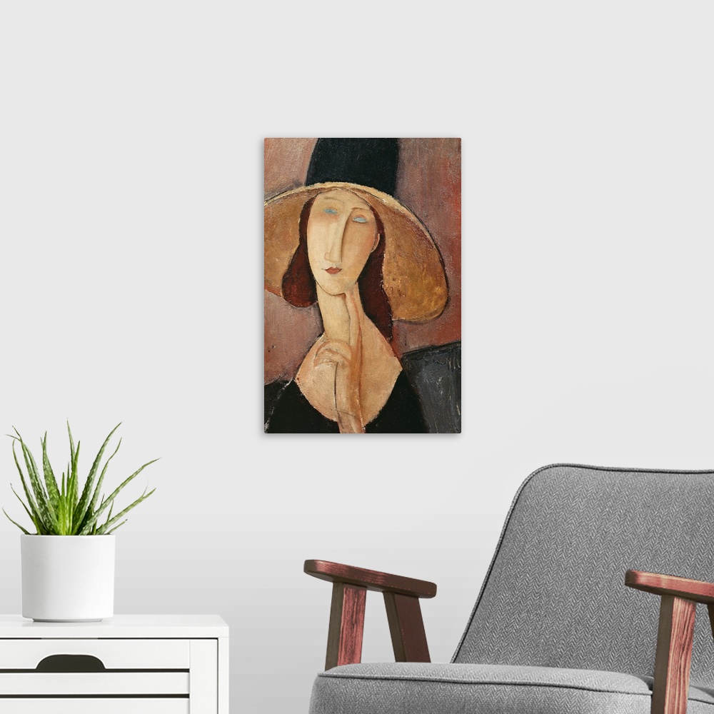 A modern room featuring Portrait of Jeanne Hebuterne in a large hat, c.1918-19