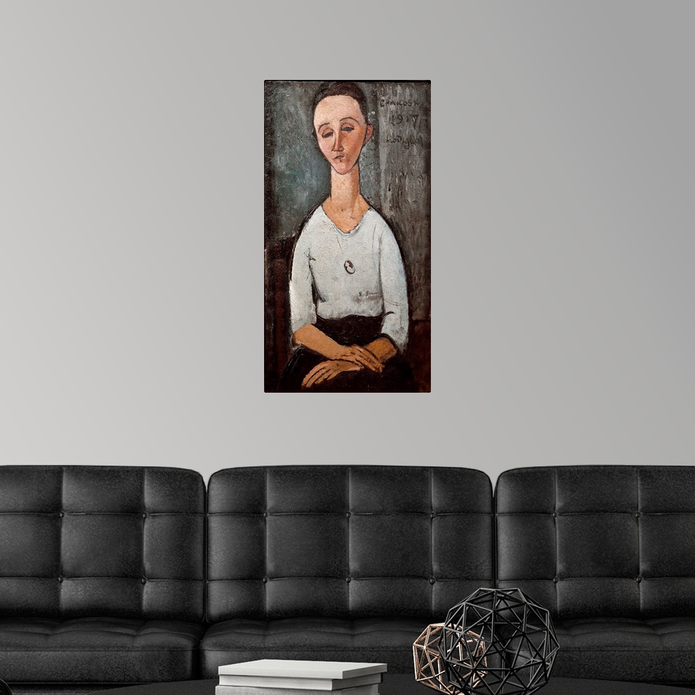 A modern room featuring Portrait of Mrs. Chakoska. Painting by Amedeo Modigliani (1884-1920), 1917.