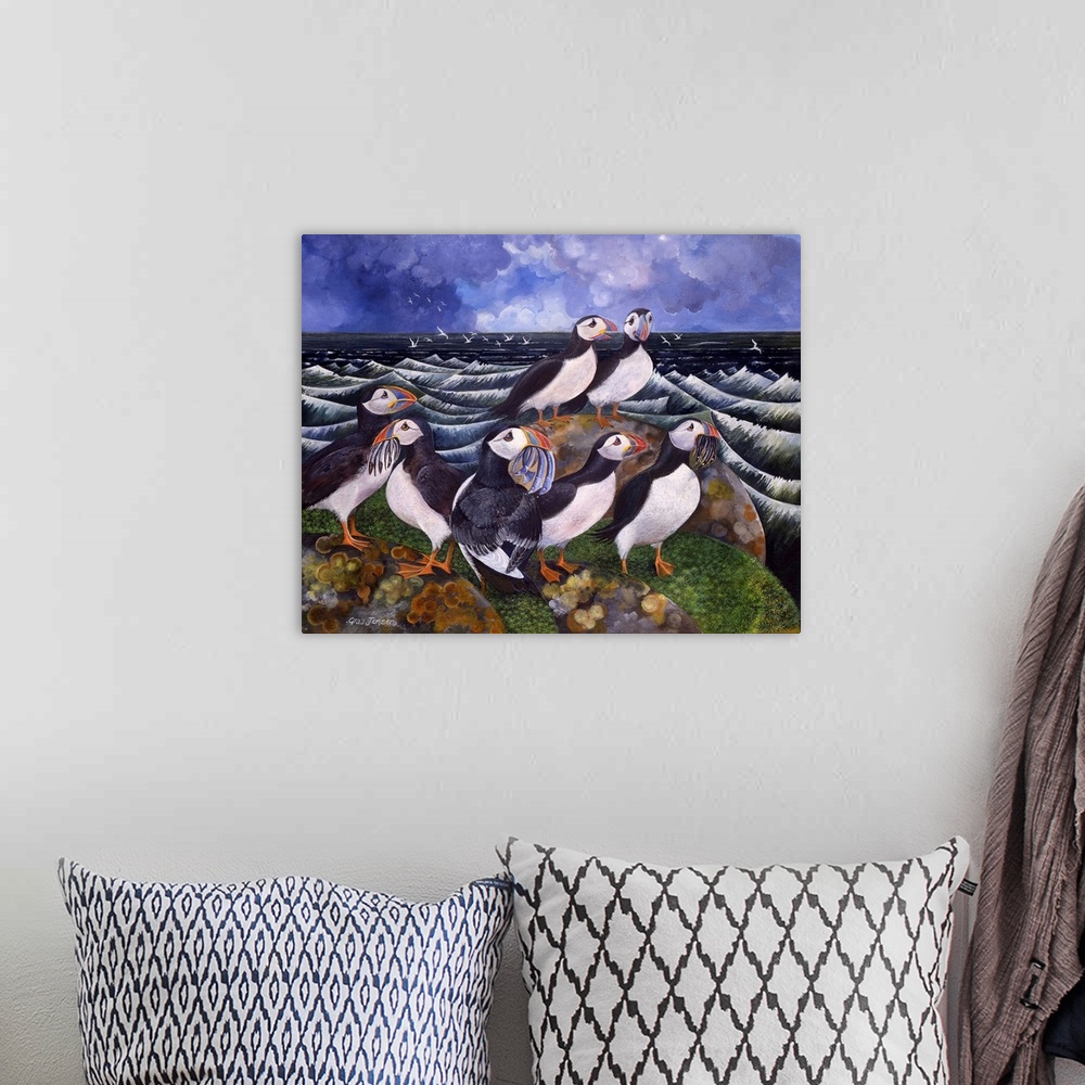 A bohemian room featuring Contemporary painting of a puffins on a rock eating fish.
