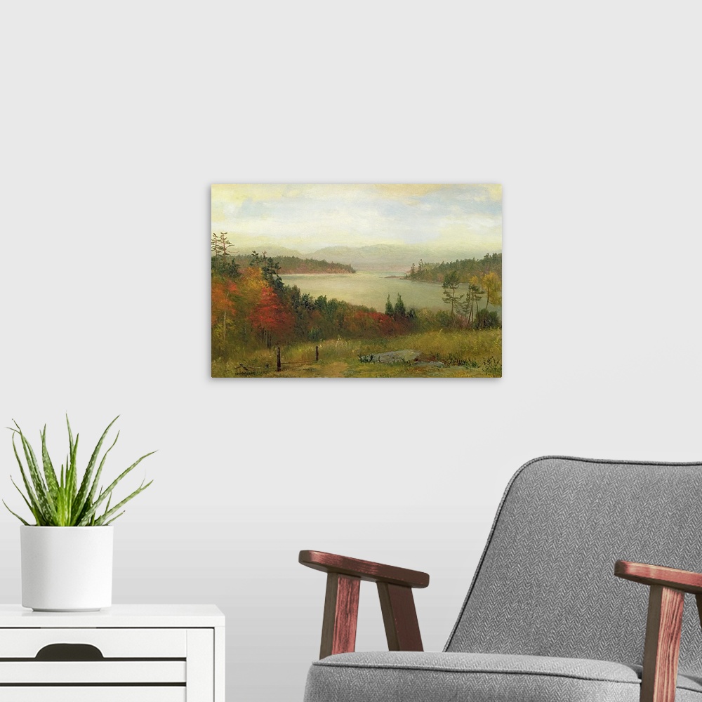 A modern room featuring Painting of river surrounded by fall forest with mountains in the distance under a cloudy sky.