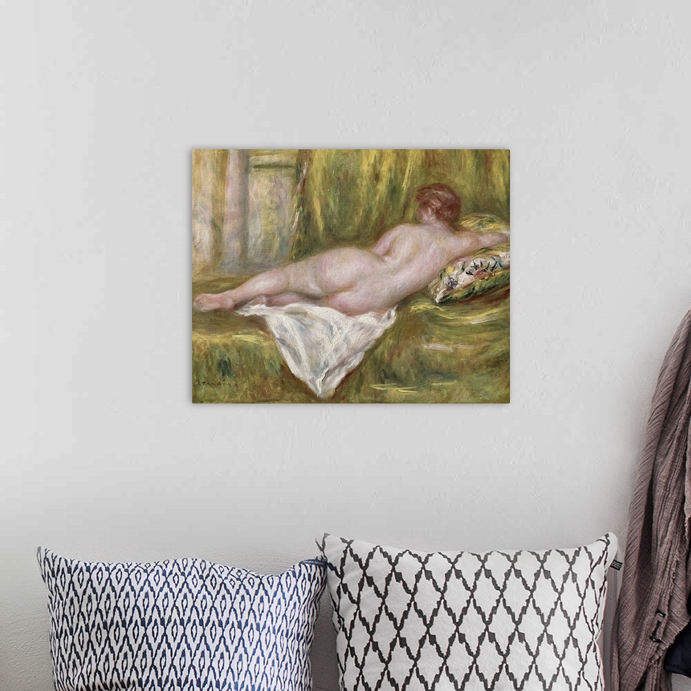 A bohemian room featuring Landscape classic painting of the back of a nude woman as she lays on her side on a blanketed sur...