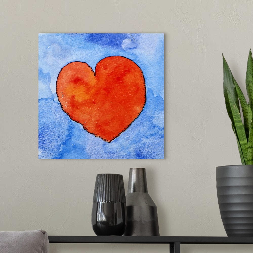 A modern room featuring Watercolor painting of a bright red heart against a light blue background.