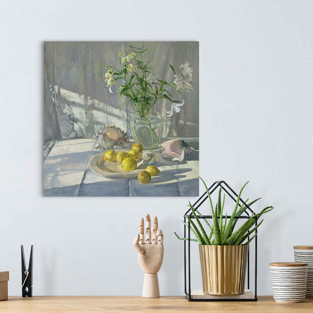 A bohemian room featuring Square oil painting of flowers in a vase with sea shells scattered around and lemons on a plate.