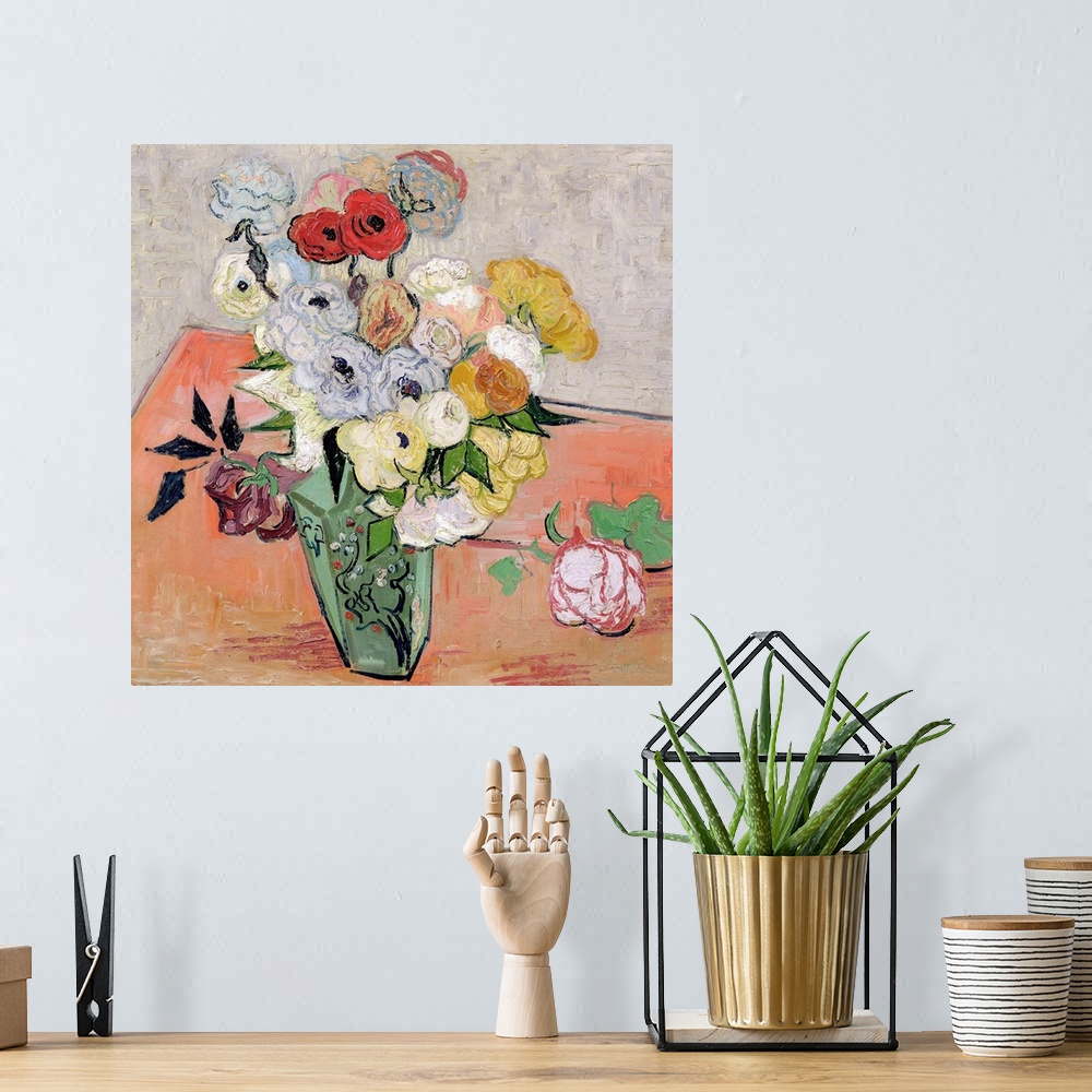 A bohemian room featuring Big classic art depicts an arrangement of flowers within a decorated vase sitting on a table.