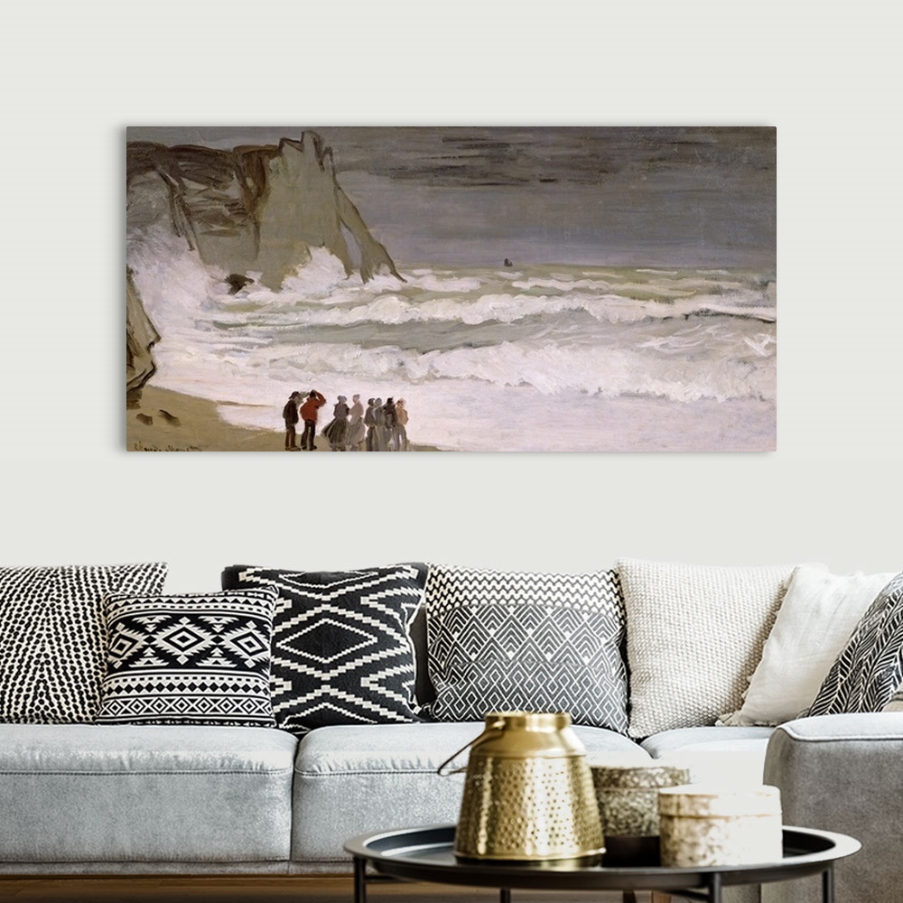 A bohemian room featuring Painting of people standing at water's edge and watching the waves comes crashing in.