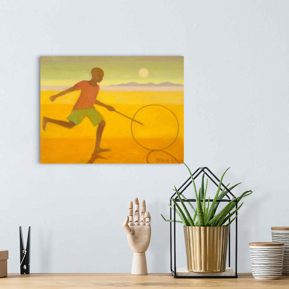 A bohemian room featuring Contemporary artwork of a boy running on the beach with a hoop and stick.