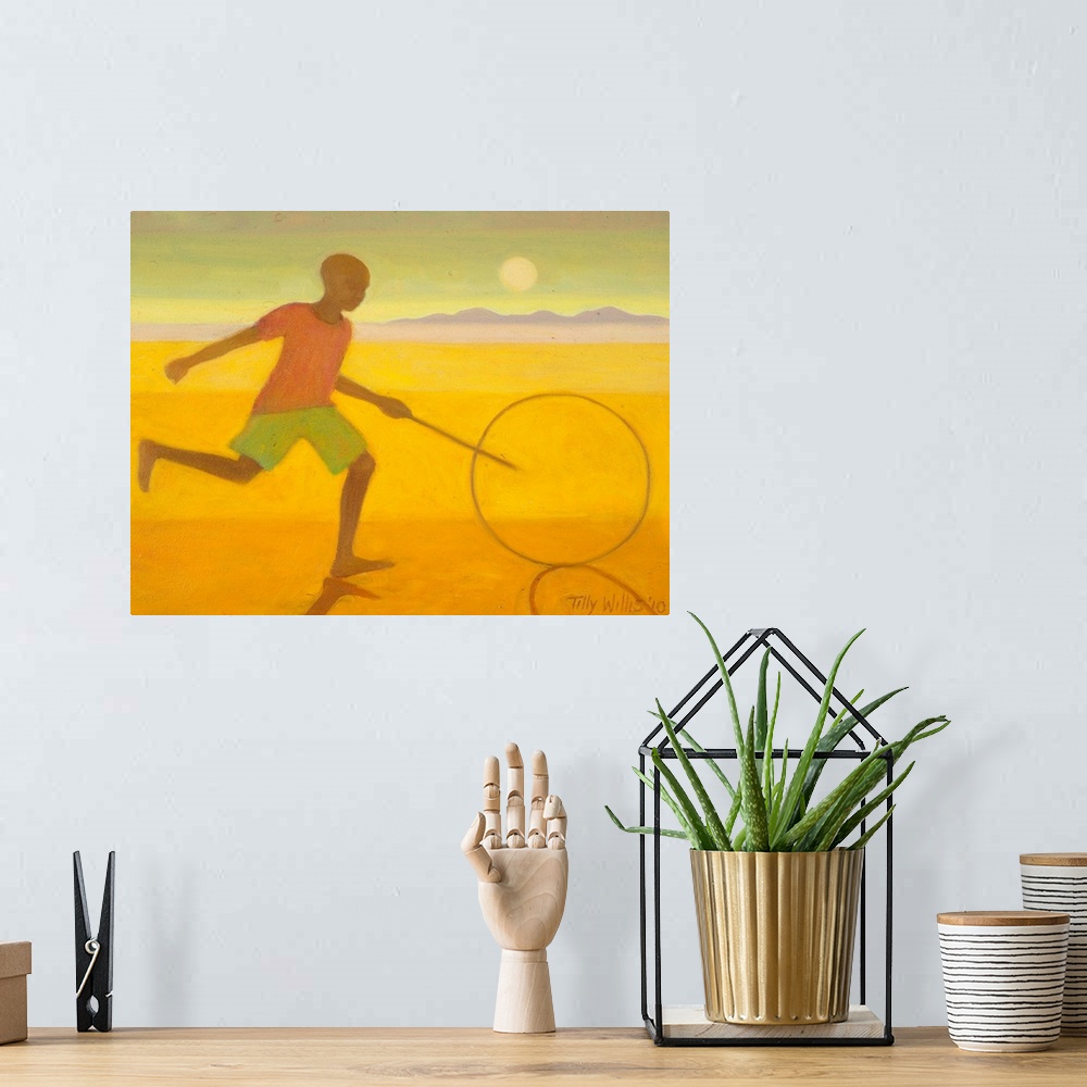 A bohemian room featuring Contemporary artwork of a boy running on the beach with a hoop and stick.