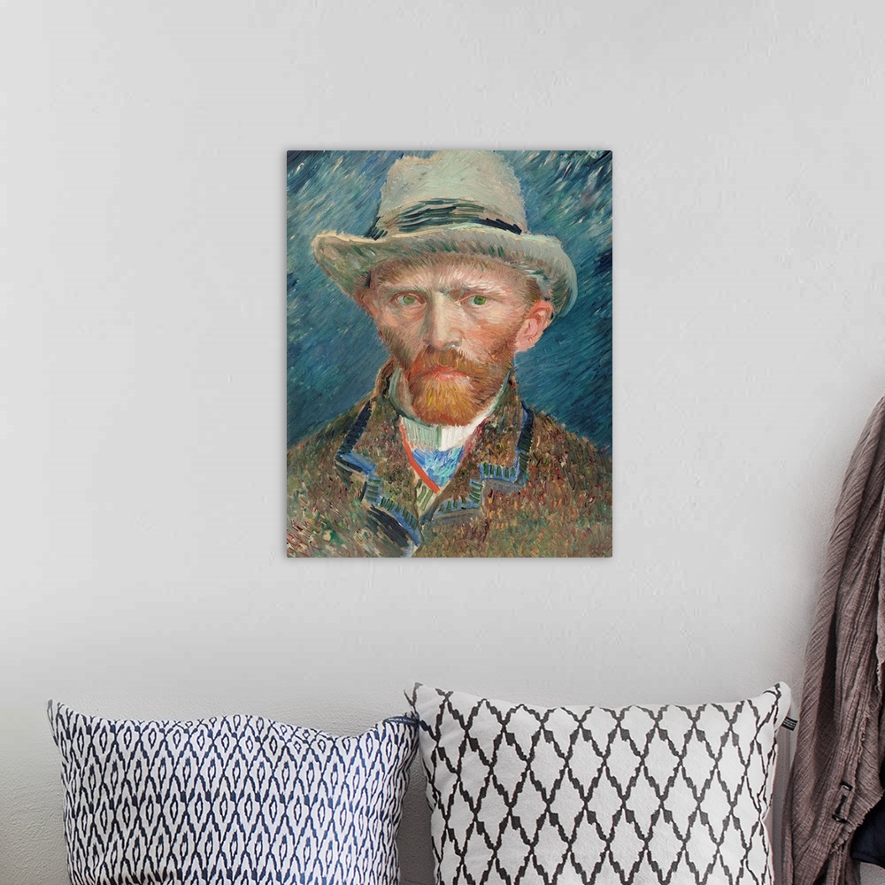 A bohemian room featuring Self portrait of Vincent Van Gogh wearing a hat.