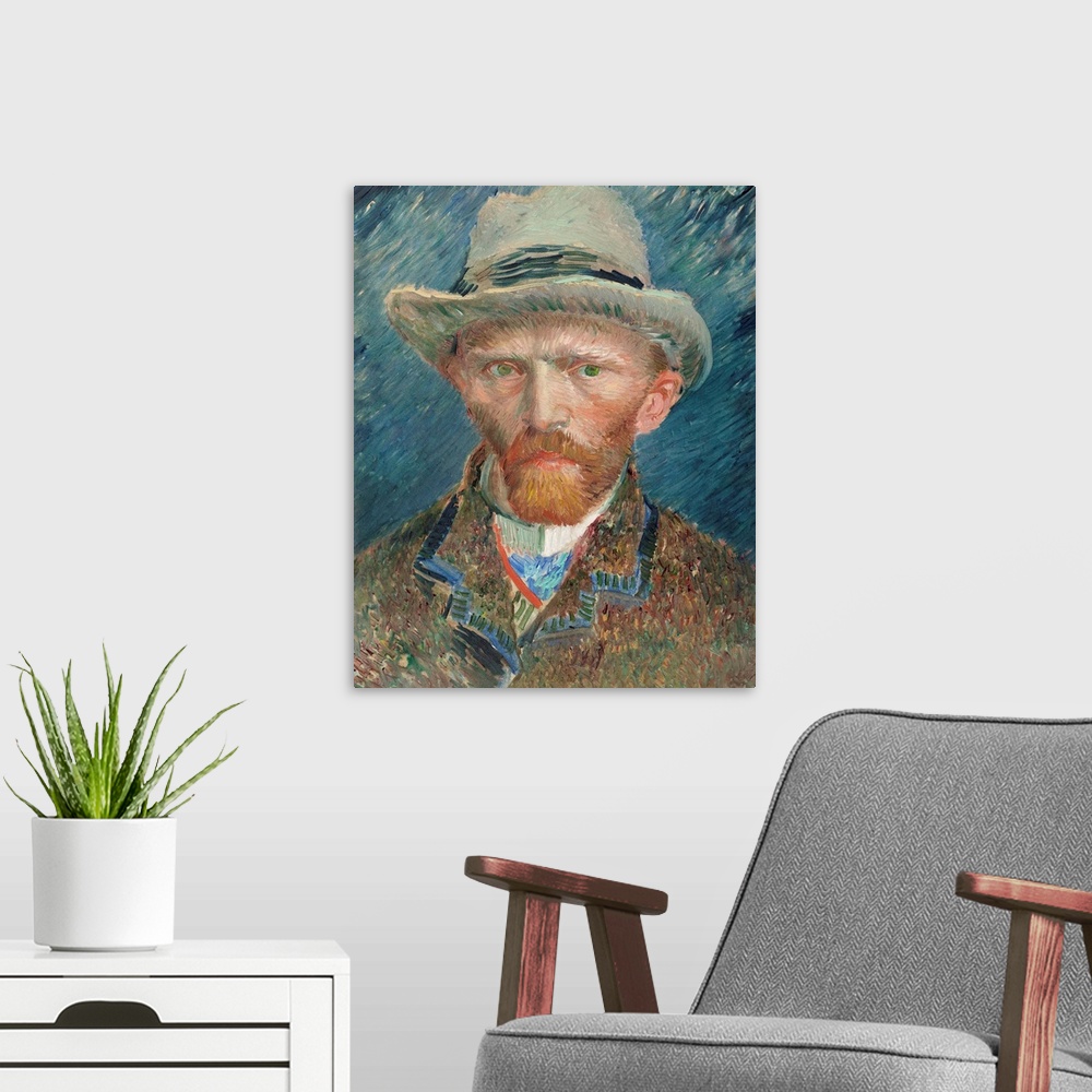 A modern room featuring Self portrait of Vincent Van Gogh wearing a hat.