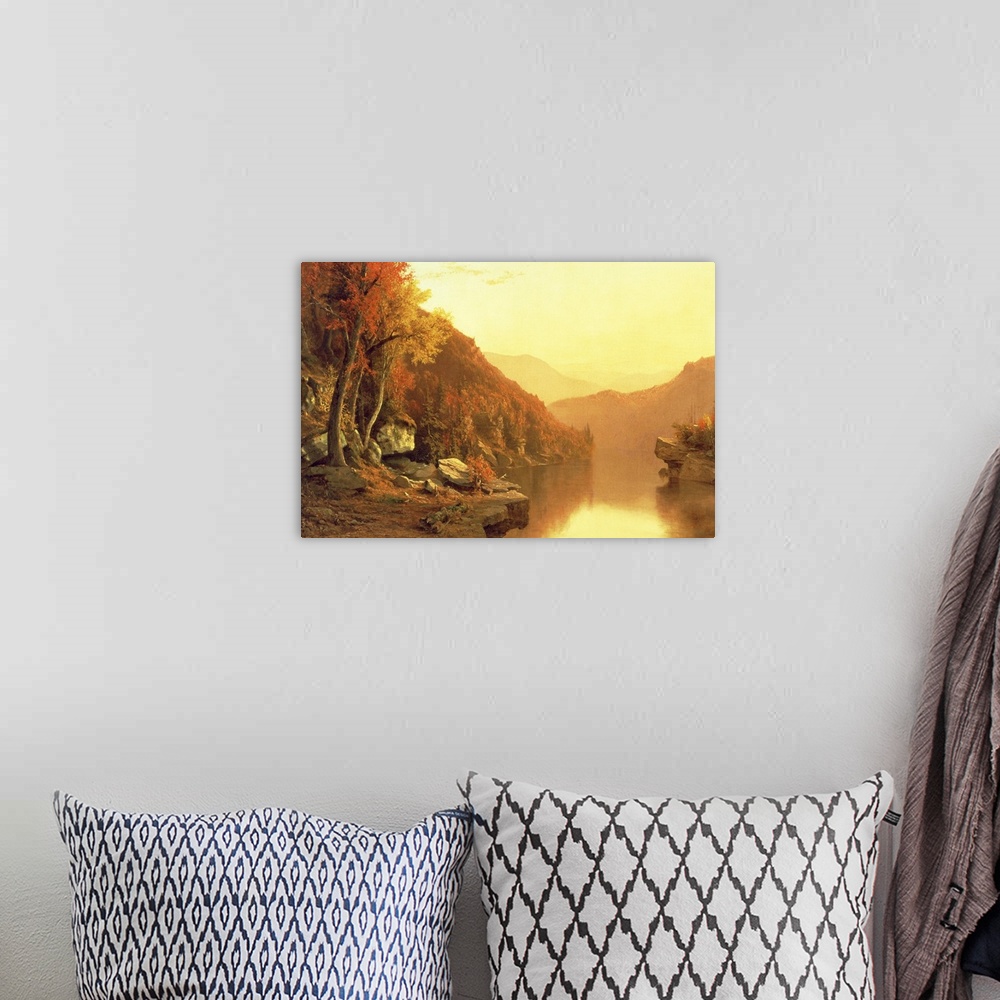 A bohemian room featuring A large oil painting done of mountains during the fall season with a river running through it and...