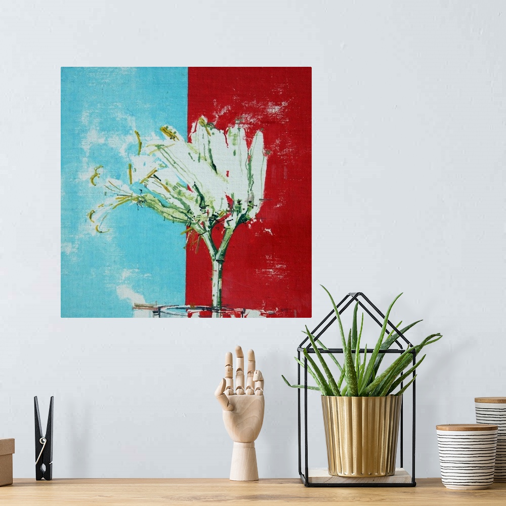 A bohemian room featuring White flower against a blue and red background.