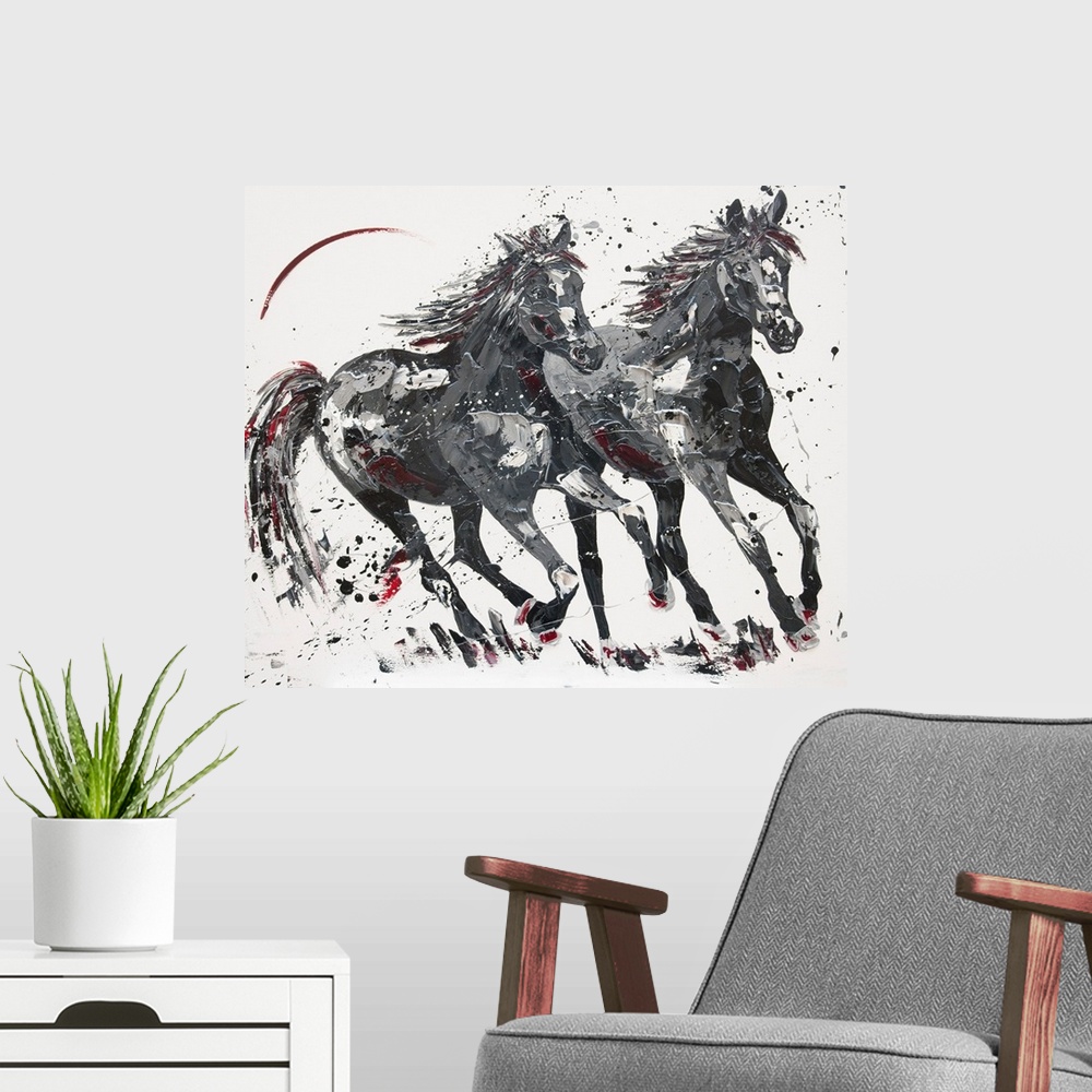 A modern room featuring Contemporary painting of two galloping horses in shades of black with red.