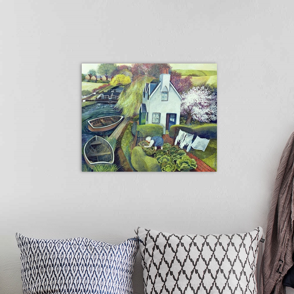A bohemian room featuring Contemporary painting of a house on the river with boats docked.