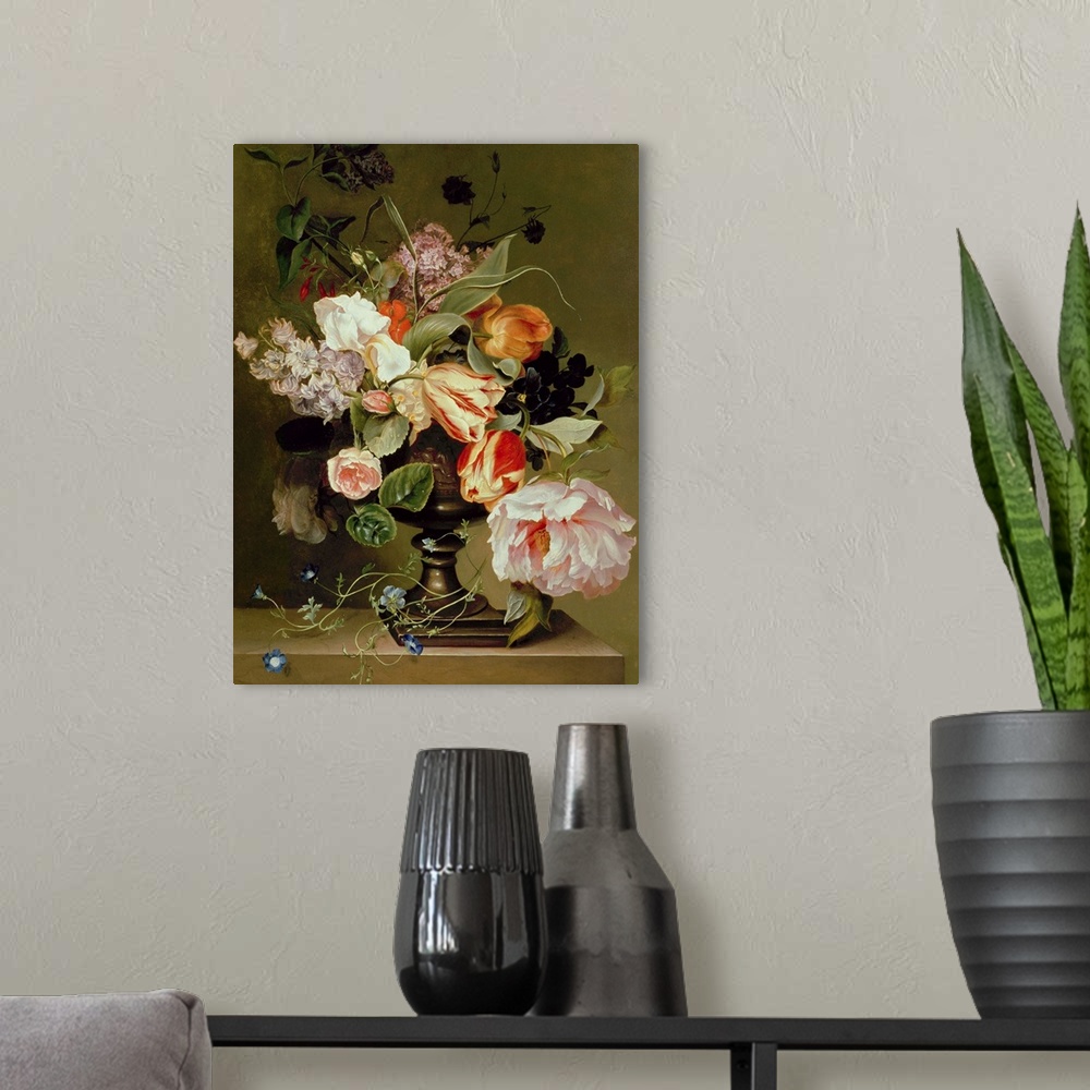 A modern room featuring Portrait artwork on a large canvas of a floral still life.  Numerous types of lowers and leaves h...