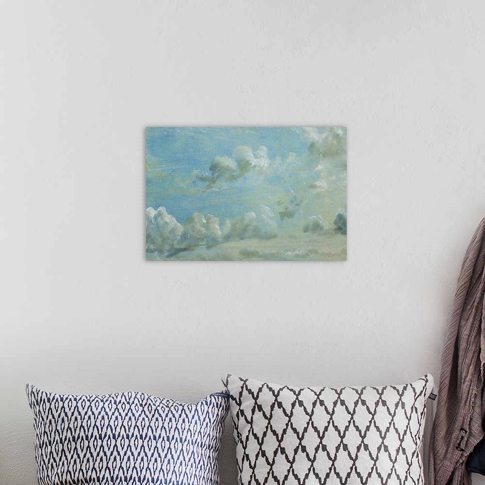 A bohemian room featuring Horizontal painting on a large wall hanging of a light blue sky full of small fluffy clouds, the ...