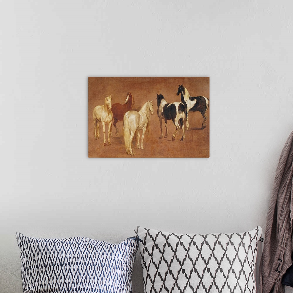 A bohemian room featuring An oil painting of five horses in various positions and coloring.