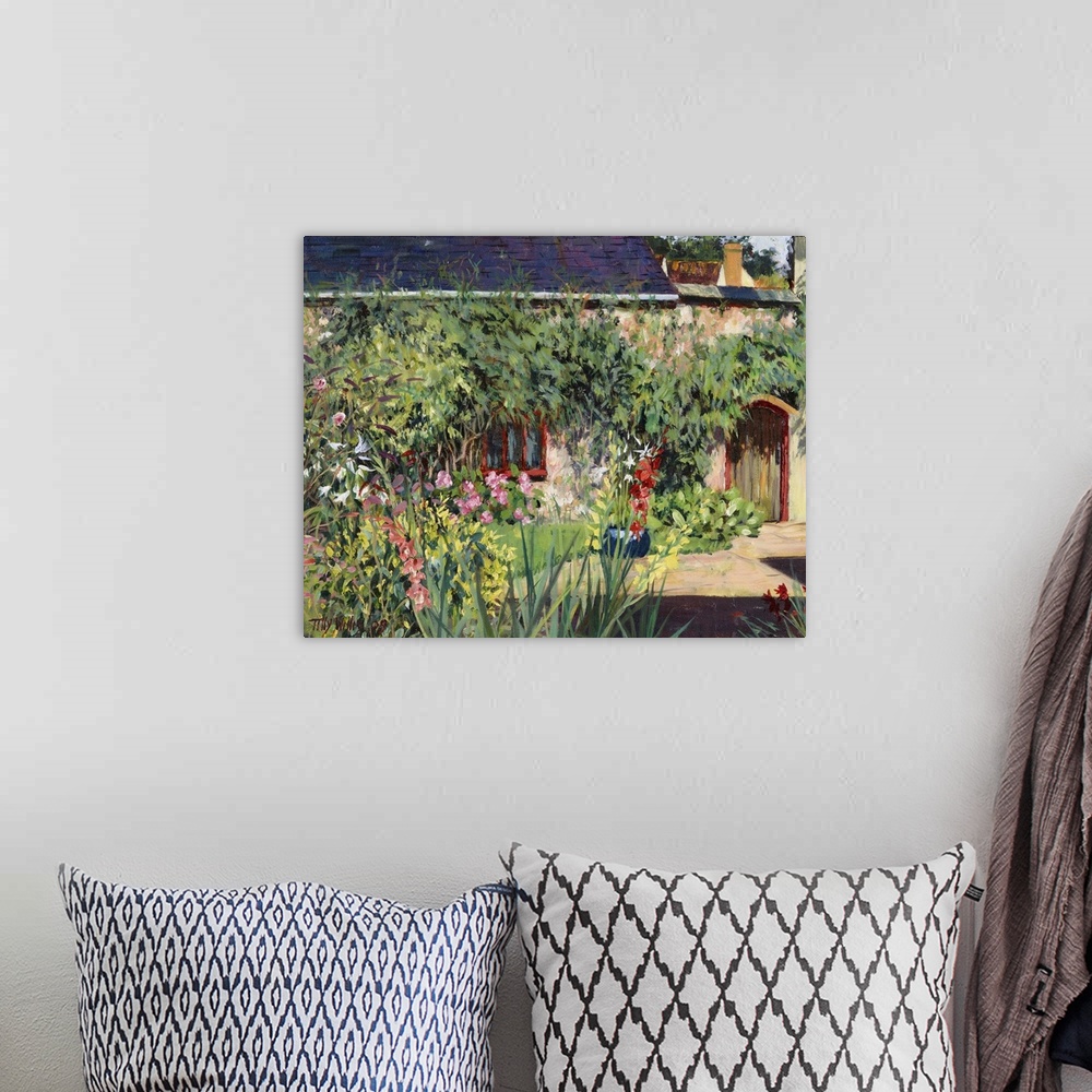 A bohemian room featuring Horizontal painting on a big wall hanging of a lush garden full of numerous flowers and foliage, ...
