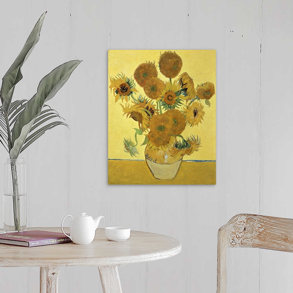 A farmhouse room featuring Vincent Van Gogh's famous oil on canvas painting of sunflowers in a vase in warm tones.
