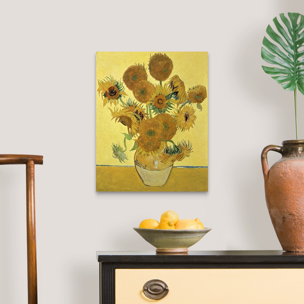 A traditional room featuring Vincent Van Gogh's famous oil on canvas painting of sunflowers in a vase in warm tones.