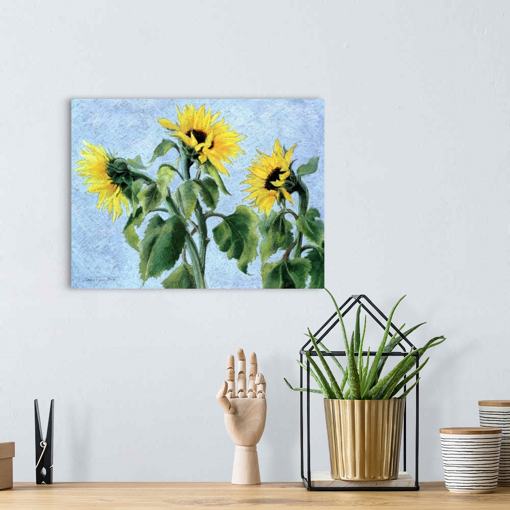 A bohemian room featuring Contemporary painting of three large sunflowers.