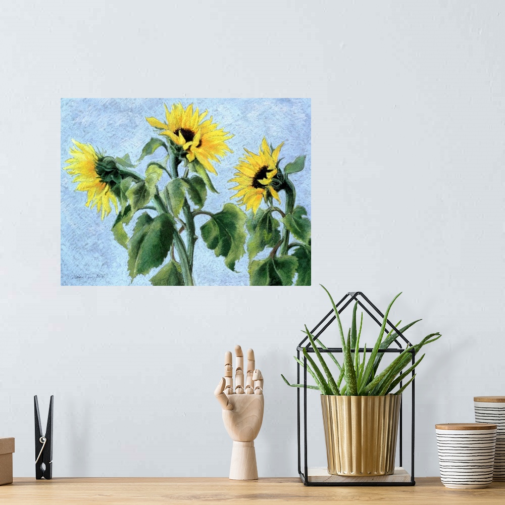 A bohemian room featuring Contemporary painting of three large sunflowers.