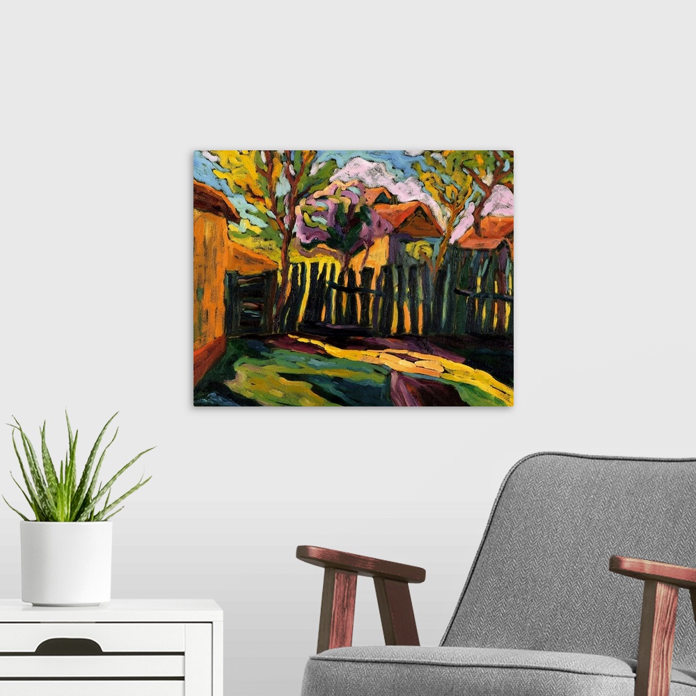 A modern room featuring Contemporary artwork that shows a small painted fence with few trees behind it and other homes ju...