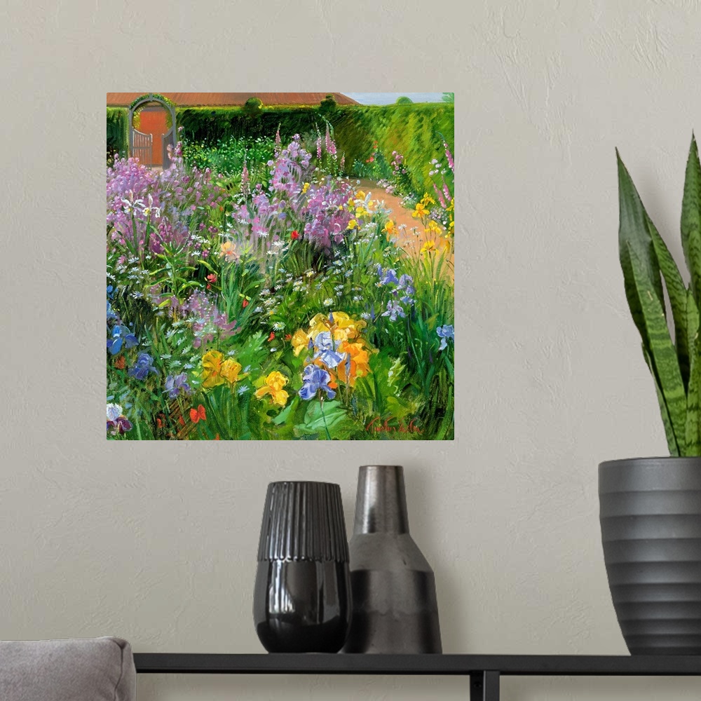A modern room featuring Square painting of different types and colors of flowers planted in a garden.