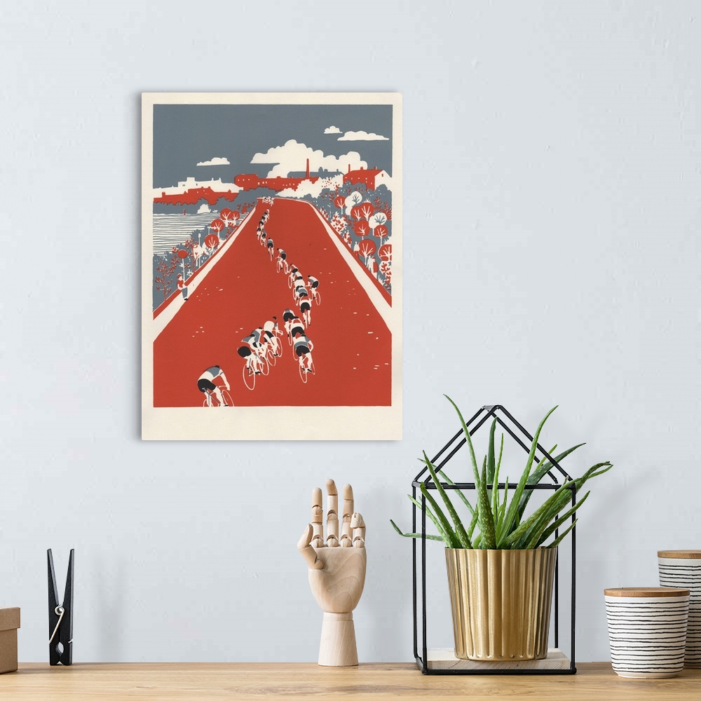 A bohemian room featuring Contemporary artwork of a cyclists on a red road.